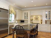 Bright and white farmhouse style kitchen with stainless steel appliances